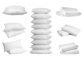 Collage of different soft pillows with white background 